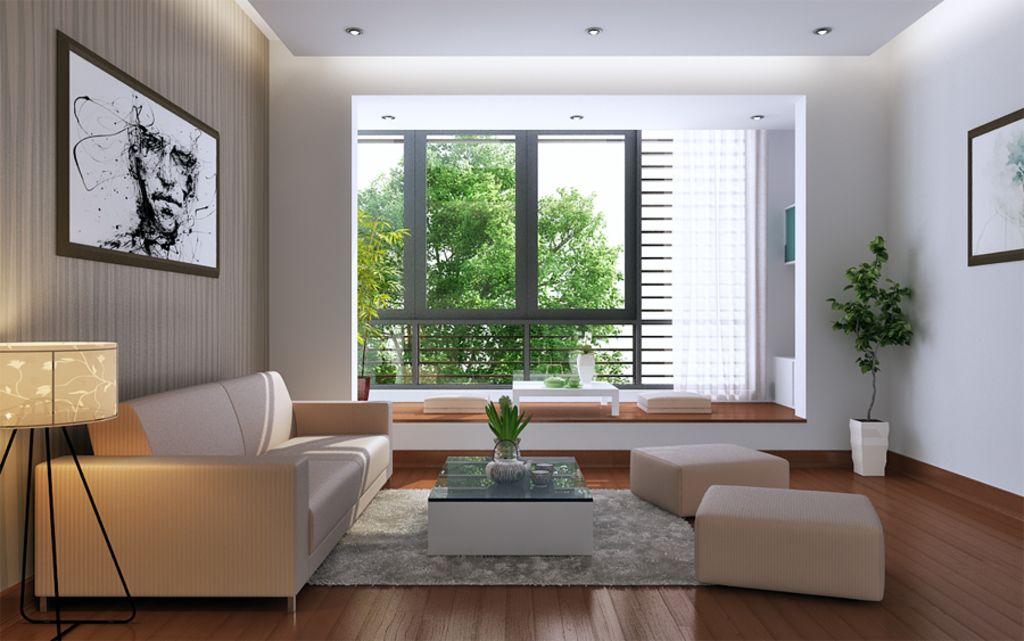 Modern living room with a pale sofa, a low table and a wide window onto green trees