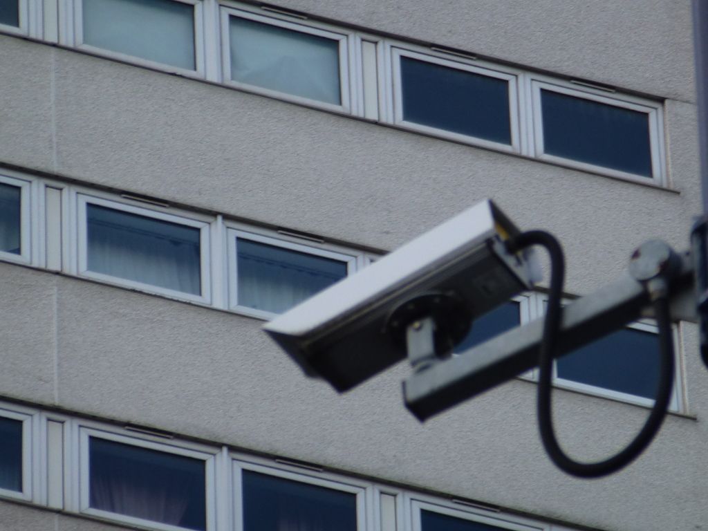 Security camera mounted on the outside wall of a building